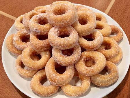 Doughnut topped with sugar icing delicious sweet light mealの写真素材