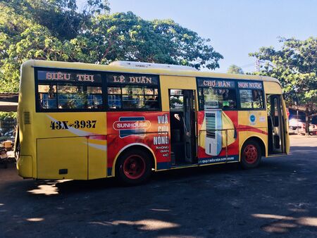 Public classic local bus driving between Hoi An and Danang, Vietnamのeditorial素材