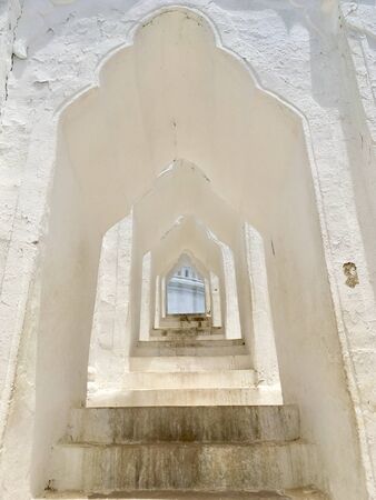 Beautiful white arch curved part of Hsinbyume pagoda (Mya Thein Tan) pagoda in Mingun near Mandalay city, Myanmarの写真素材
