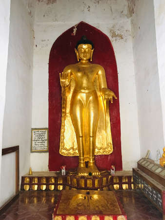 Standing golden Buddha image at Shwezigon Pagoda in Bagan city, Myanmarのeditorial素材