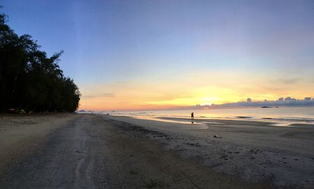 Scenery of empty sea beach sand and twilight sky on sunset timeの写真素材