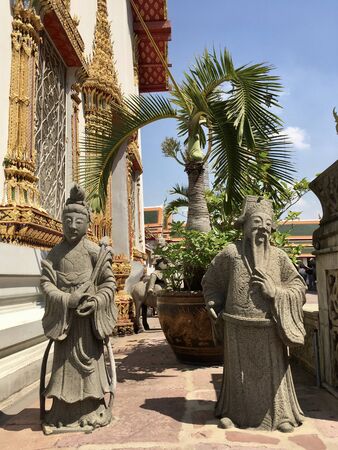 Ancient graybeard statue decorate around external at Wat Pho temple in Bangkok, Thailandの写真素材