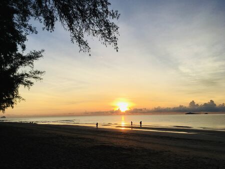 Scenery of empty sea beach sand and twilight sky on sunset timeの写真素材