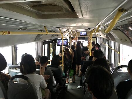 Peopleful in public bus, many people go to working by public bus transportation in cityの写真素材