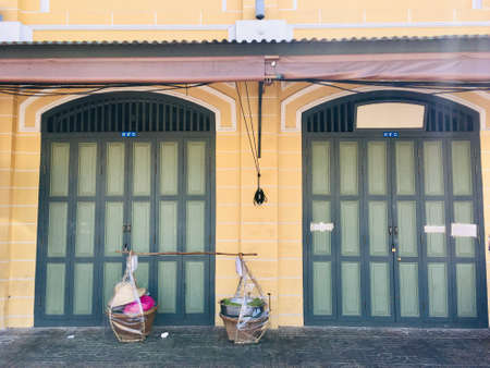 Old wooden door vintage ancient style exterior of Thai house in Bangkok cityの写真素材