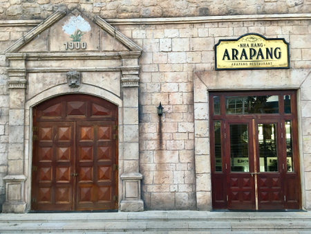 Exterior decoration wooden door and brick wall ancient of European style house (French village at Ba Na Hills, Vietnam)のeditorial素材