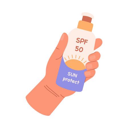 Hand holding sunscreen bottle with label. Vector illustration in flat style.のイラスト素材
