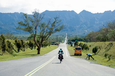 Woman bicyclist cycle around the island in Taiwan, ride cyclist stylized picture, road cycling, cycling tour, cycling track, bicycleの写真素材
