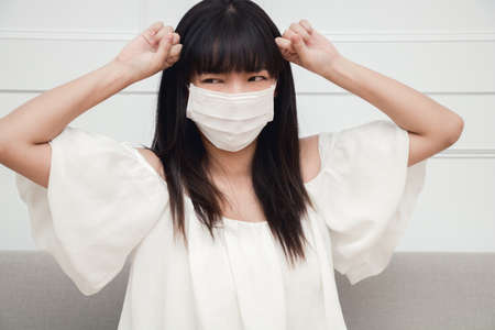 Woman suffer from cough with face mask protection.の写真素材