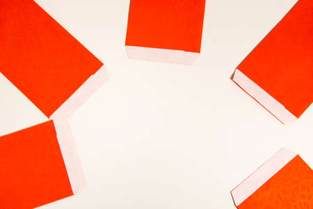 Red envelope packet on white background.の写真素材