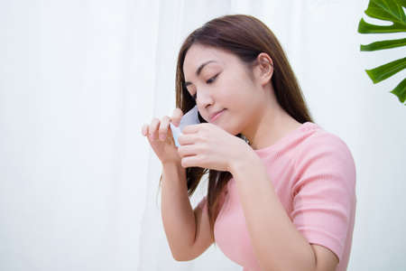 Woman suffer from cough with face mask protection.の写真素材