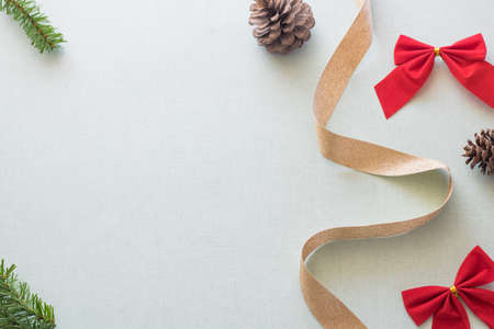 Christmas background with gift boxes, pine cone and decorations on light blue background. Preparation for holidays. Top view with copy space.の写真素材