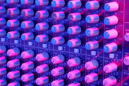 Sound mixer buttons with strong colored light.