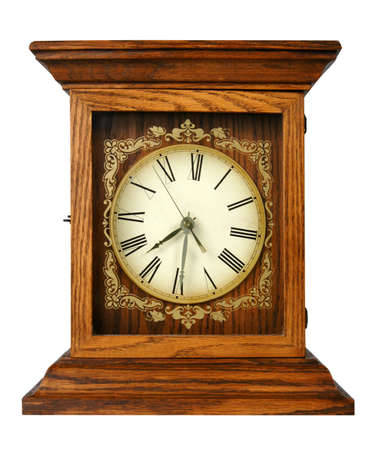 Old grungy clock with Roman numerals isolated over a white background.の写真素材