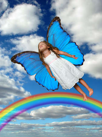 Fairy flying above the rainbowの写真素材