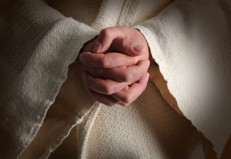 The hands of Jesus clasped in prayerの写真素材