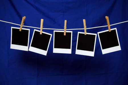 Blank polaroids over a blue backgroundの写真素材
