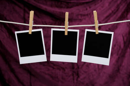 Blank Polaroid photos over a purple backgroundの写真素材