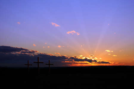 Colorful sunset with three crossesの写真素材