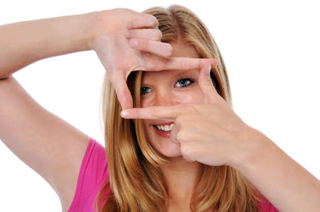 Young beautiful woman framing face with fingersの写真素材