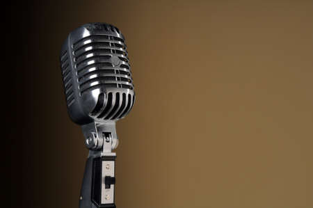 Vintage microphone over a gradient backgroundの写真素材