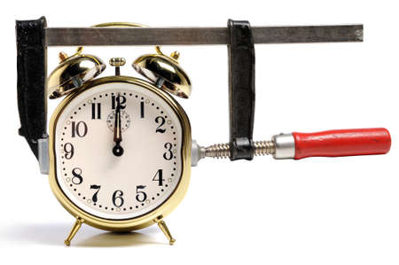 Pressed by time concept symbolized by press and time clockの写真素材