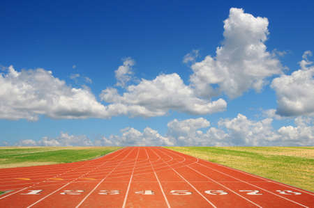 Running track with eight lanes with sky and cloudsの写真素材