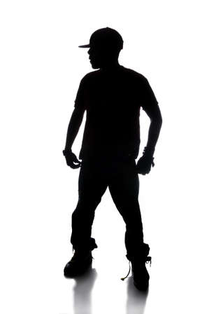 Dilhouette of hip hop dancer over a white backgroundの写真素材