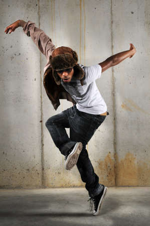 African American hip hop man dancing over a grungy backgroundの写真素材