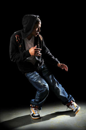 Hip hop dancer performing with stron directional light