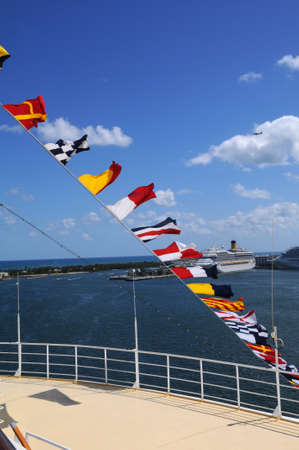 Nautical flags at ship docked at portの写真素材