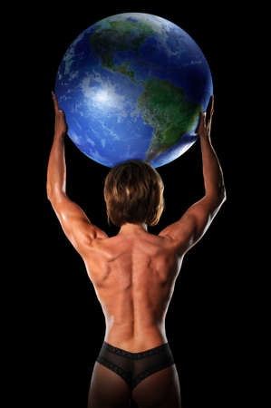 Female bodybuilder lifting planet earth isolated over a black backgroundの写真素材