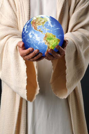 The hands of Jesus holding planet earthの写真素材