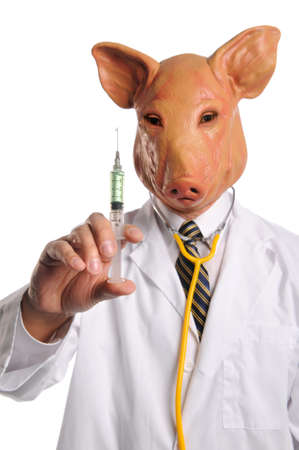 Doctor with pig's head holding syringe - Selective focus of syringeの写真素材