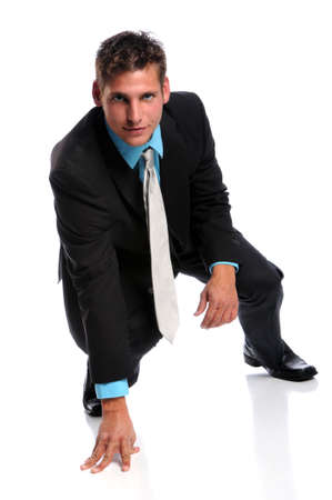 Businessman at starting line isolated over white backgroundの写真素材