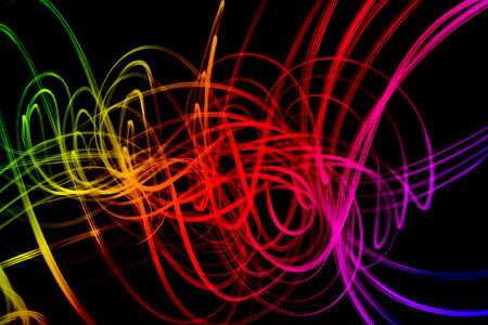 Waves of multicolor forms isolated over black background