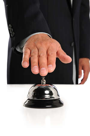 Hand of businessman ringing bell