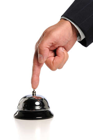 Hand ringing bell isolated over white backgroundの写真素材