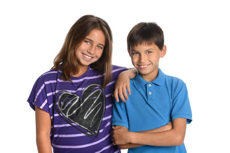 Girl and boy siblings smiling isolated over white background