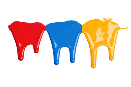 Red, blue, and yellow paint dripping isolated over white backgroundの写真素材