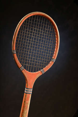 Vintage tennis racket over dark backgroundの写真素材
