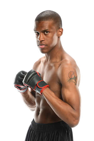 Portrait of young African American man with mixed martial arts gloves isolated over white backgroundの写真素材