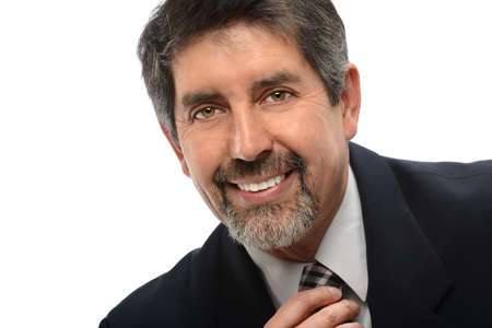 Portrait of mature Hispanic businessman isolated over white backgroundの写真素材