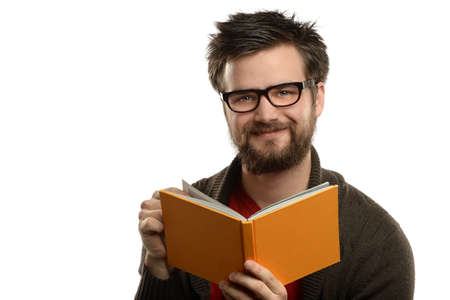 Portrait of man with glasses and beard reading book isolated over white background