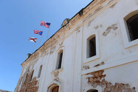 Flags atop building in Castillo San Cristobal, San Juan Puerto Ricoの写真素材