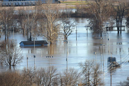 VALLEY PARK, MO/USA - JANUARY 1, 2016: Flood waters nearly submerge house in Valley Park in old town Fenton.のeditorial素材