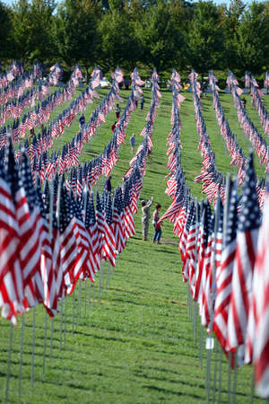 Saint Louis, MO â September 11, 2016: More than 7,000 flags with name, photo and dog tag of soldier killed defending the United States wave outside the St. Louis Art Museum in Saint Louis, Missouriのeditorial素材