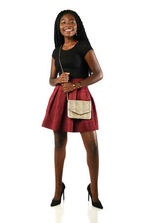 Portrait of African American woman in skirt isolated over white backgroundの写真素材