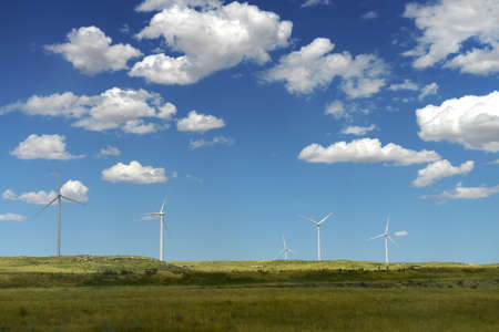 Wind turbines in open field during bright dayの写真素材
