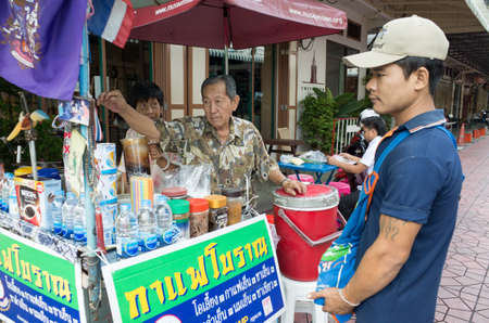 A man is waiting for his coffee at coffee stand shop in Thailand.Oct,1,2015のeditorial素材